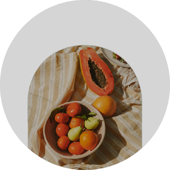 Anti-inflammatory Nutrition Guide A section of the cover of the Anti-inflammatory Nutrition Guide ebook, showing a bowl of fruits on a table.