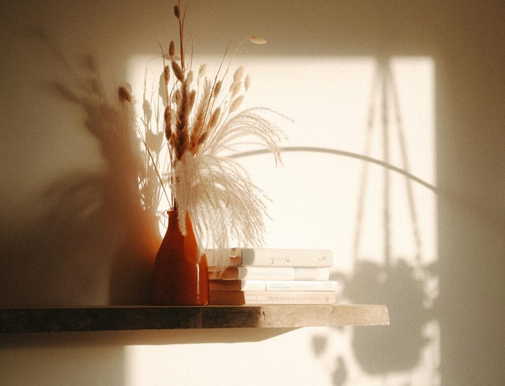 a couple of vases sitting on top of a shelf